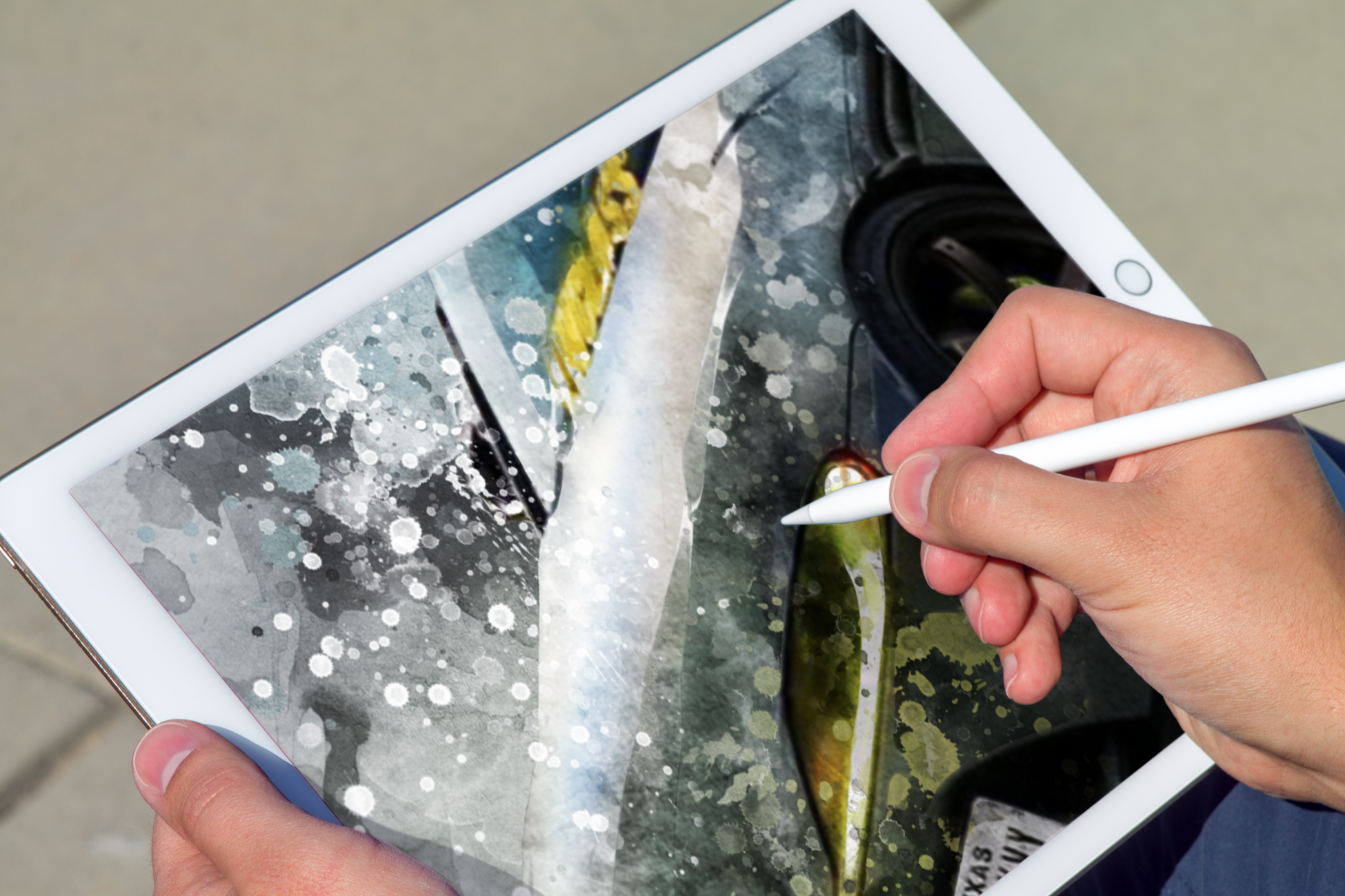 Person using a stylus to interact with a tablet displaying an image of fish.